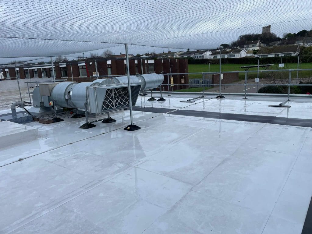 Flat Roof Cleaning: Preventing Leaks, Ponding & Membrane Damage